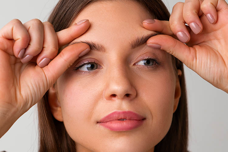 Why Do Lines and Indentations Between the Eyebrows Occur and How Are They Treated?